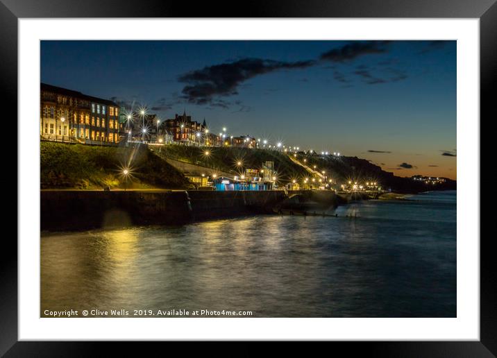 Cromer at night taken from the pier in Norfolk Framed Mounted Print by Clive Wells