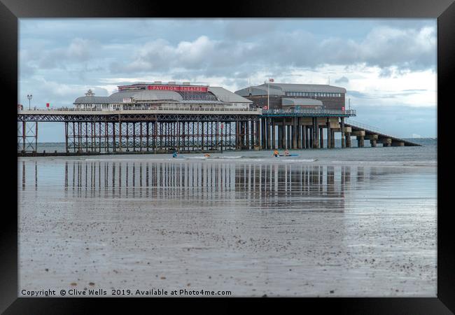 Reflections of Cromer Pier in Norfolk Framed Print by Clive Wells