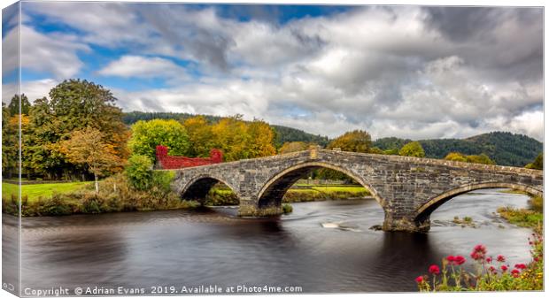 Llanrwst Stone Bridge Autumn Canvas Print by Adrian Evans