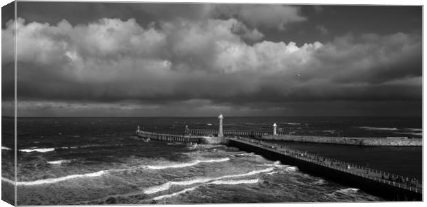 Stormy Skies over Whitby Pier  Canvas Print by Dan Ward