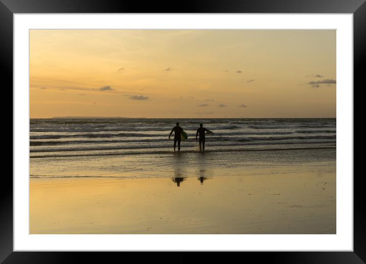 sunset surfers at Westward Ho in North Devon Framed Mounted Print by Tony Twyman