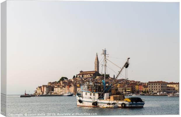 Fishing boat in Rovinj harbour Canvas Print by Jason Wells