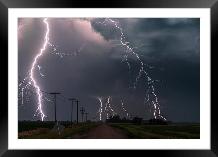 Extreme lightning with Fireflys Framed Mounted Print by John Finney