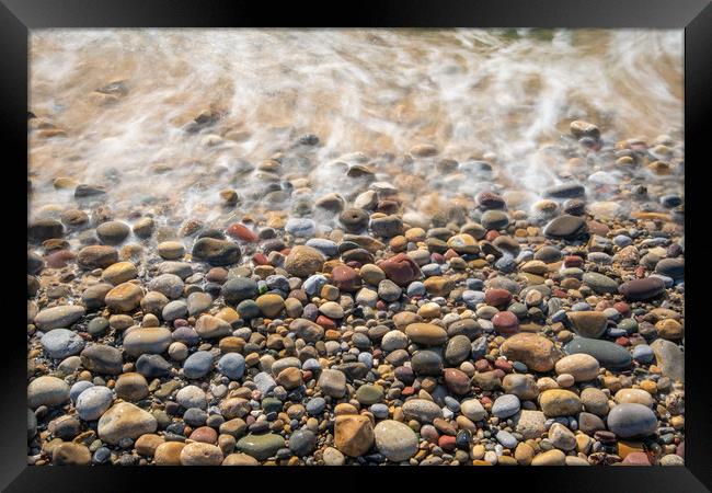 Pebbles at Bracelet bay. Framed Print by Bryn Morgan