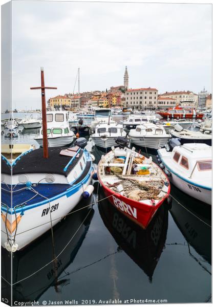 Boats bobbing in Rovinj harbour Canvas Print by Jason Wells