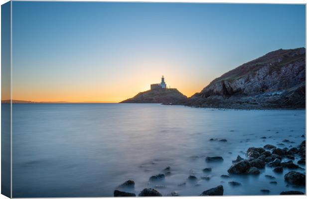 Mumbles lighthouse at sunrise. Canvas Print by Bryn Morgan