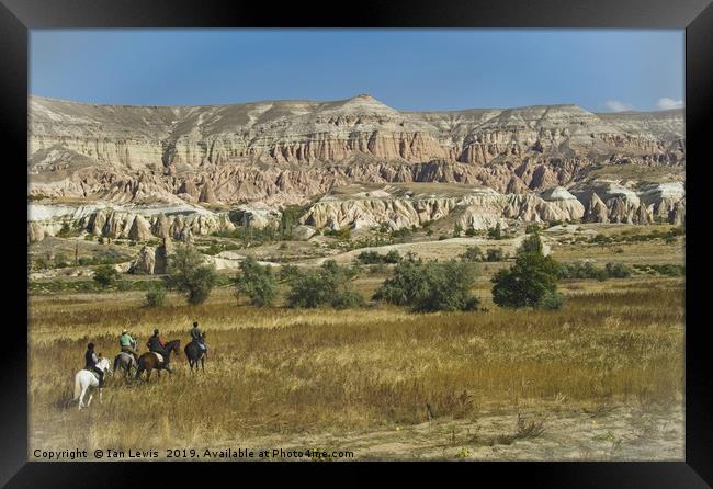 Riding Through Cappadocia Framed Print by Ian Lewis