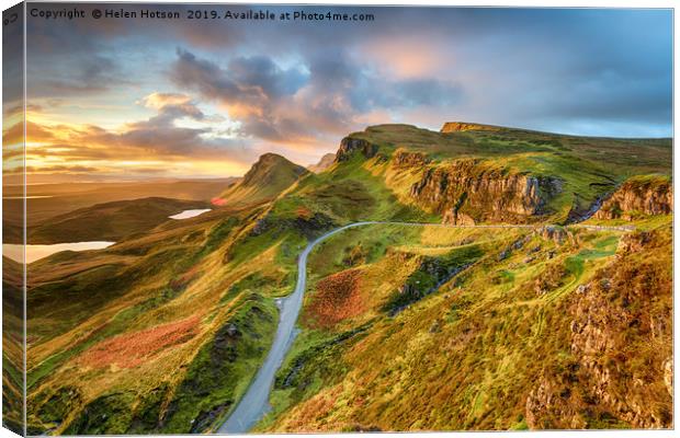 Dramatic sunrise sky over the Quiraing  Canvas Print by Helen Hotson