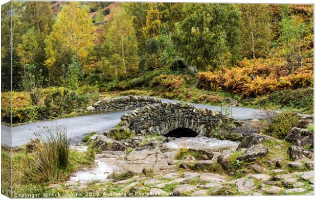 Ashness Bridge in Autumn Lake District Cumbria Canvas Print by Nick Jenkins