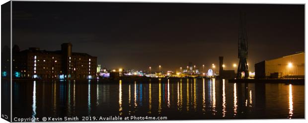 Liverpool skyline across Birkenhead Docks at night Canvas Print by Kevin Smith