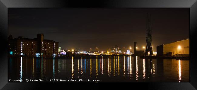 Liverpool skyline across Birkenhead Docks at night Framed Print by Kevin Smith