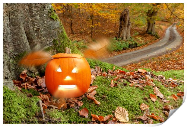 Halloween pumpkin in autumn woodland Print by Simon Bratt LRPS
