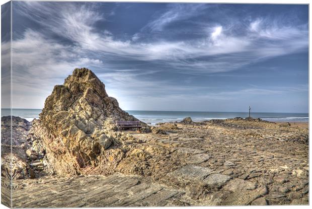 Bench on The Rocks At Bude Canvas Print by Mike Gorton