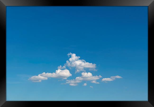 Group of clouds floating in the blue cyan sky Framed Print by Ankor Light