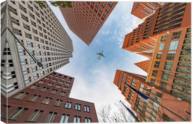 A plane flying over the headquarters and modern br Canvas Print by Ankor Light