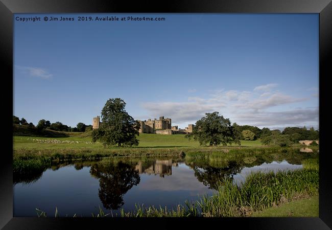 Alnwick Castle reflected in the River Aln Framed Print by Jim Jones