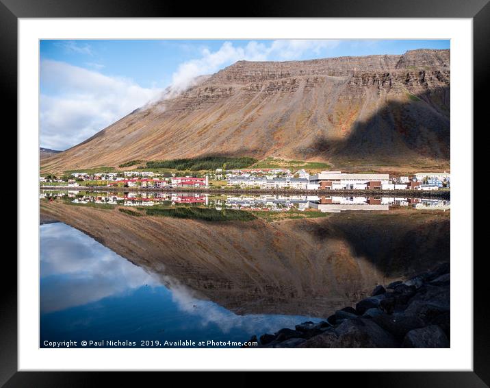 Isafjordur town in Iceland reflecting in the fjord Framed Mounted Print by Paul Nicholas