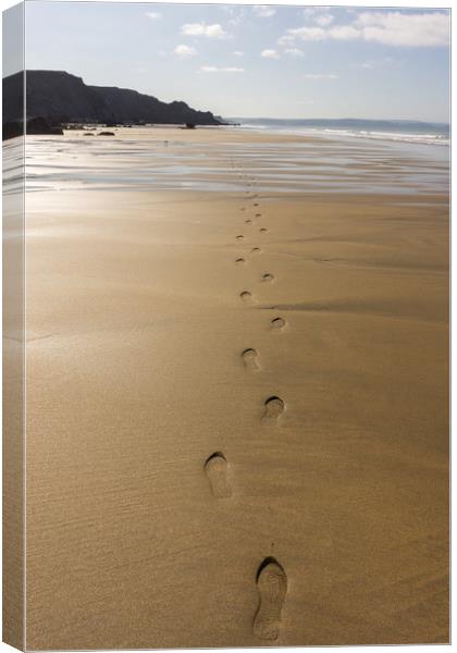 Footsteps on a deserted Cornish beach Canvas Print by Tony Twyman