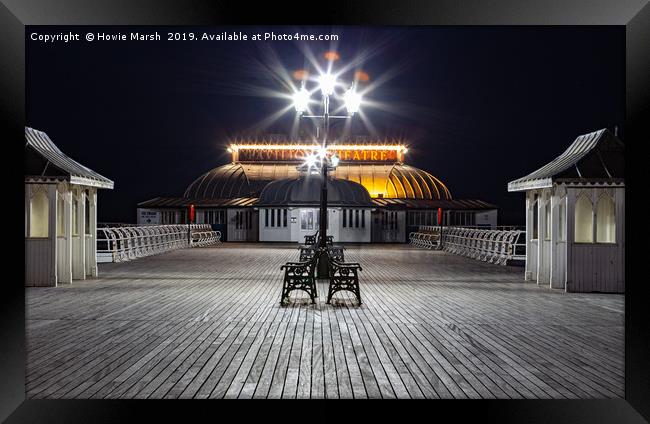 The Pier at Night Framed Print by Howie Marsh
