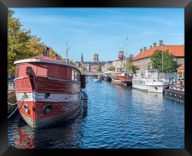 Copenhagen Canal Scene with Red Barge Framed Print by Antony McAulay