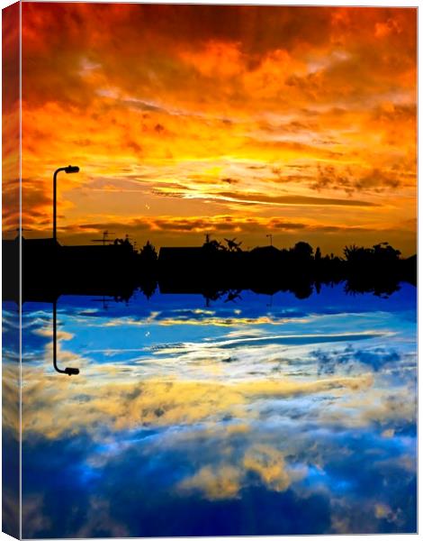 Abstract sunrise / sunset over silhouette village Canvas Print by Paul Cooper