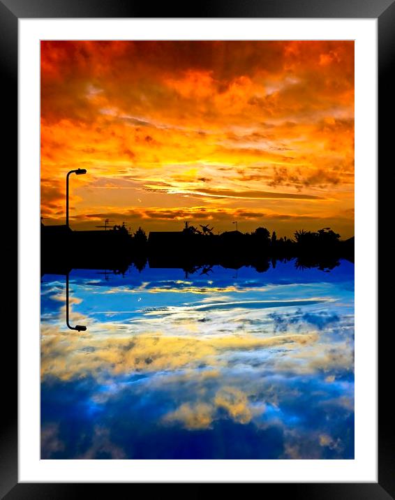 Abstract sunrise / sunset over silhouette village Framed Mounted Print by Paul Cooper