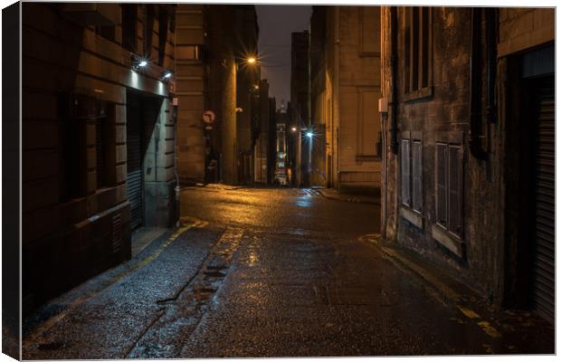 Alley In The Rain Canvas Print by Ronnie Reffin