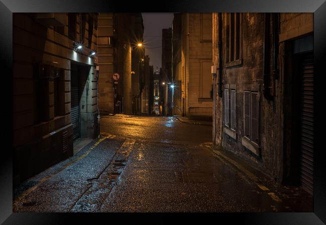 Alley In The Rain Framed Print by Ronnie Reffin