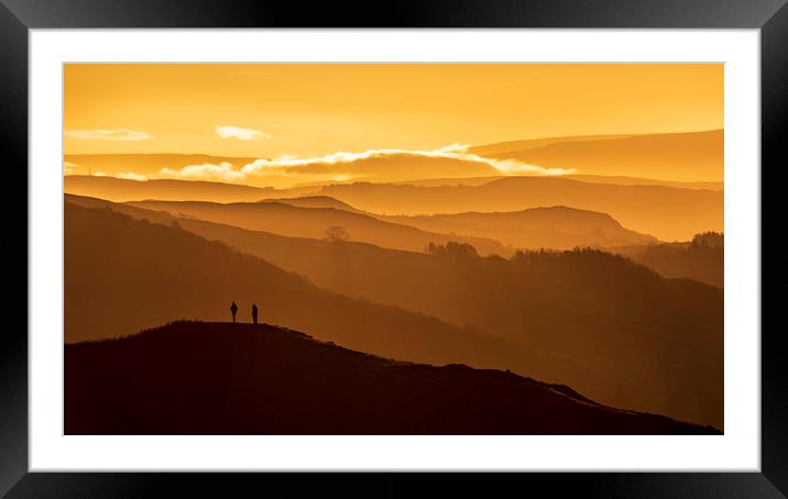 Two people stand on a mountain  Framed Mounted Print by John Finney