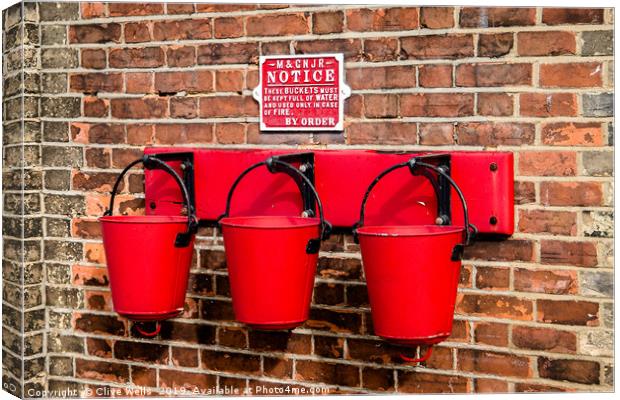 Fire buckets Canvas Print by Clive Wells