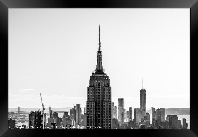 New York skyline and the Empire State Building Framed Print by Claire Turner