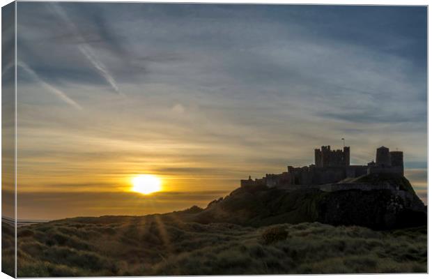 Sunset Bamburgh Castle Canvas Print by Tony Bishop