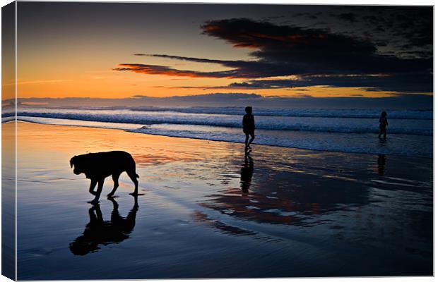 Sand, Sea and Silhouettes Canvas Print by David Lewins (LRPS)