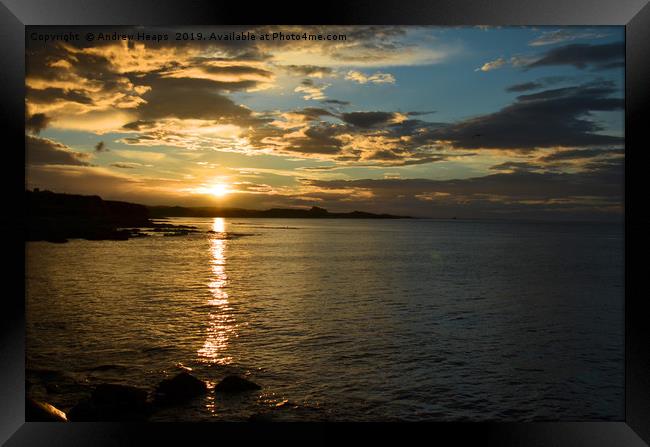 Sunset over bay in Northumberland coastline. Framed Print by Andrew Heaps