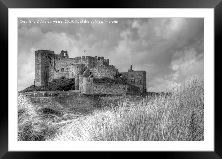 Bamburgh Castle in black and white. Framed Mounted Print by Andrew Heaps