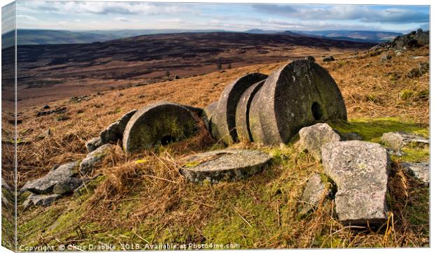 Abandoned Mill Stones, under Stanage Edge Canvas Print by Chris Drabble