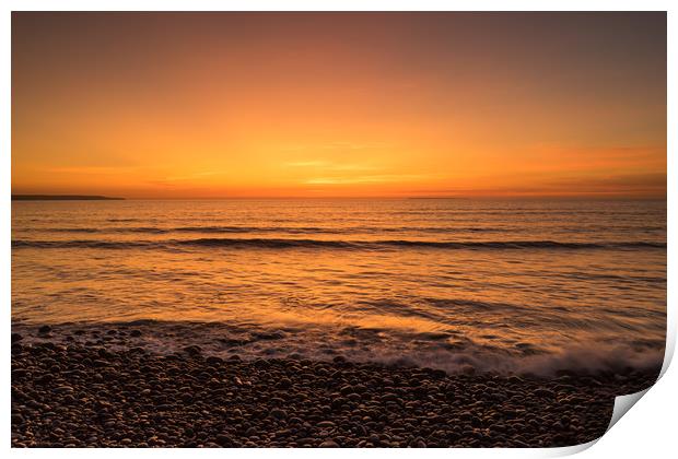 Waves on the sunset lit shoreline at Westward Ho Print by Tony Twyman