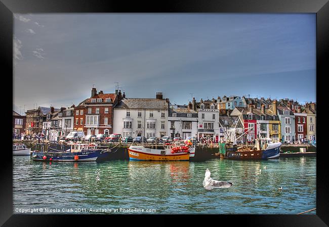 Vibrant Fishing Boats in Weymouth Framed Print by Nicola Clark
