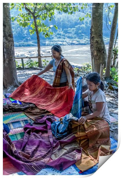 Preparing cloth for market, Laos. Print by Robert Murray