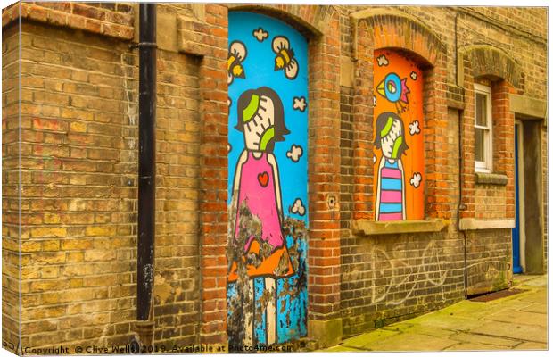 Old graffiti seen on wall in Folkestone, Kent Canvas Print by Clive Wells