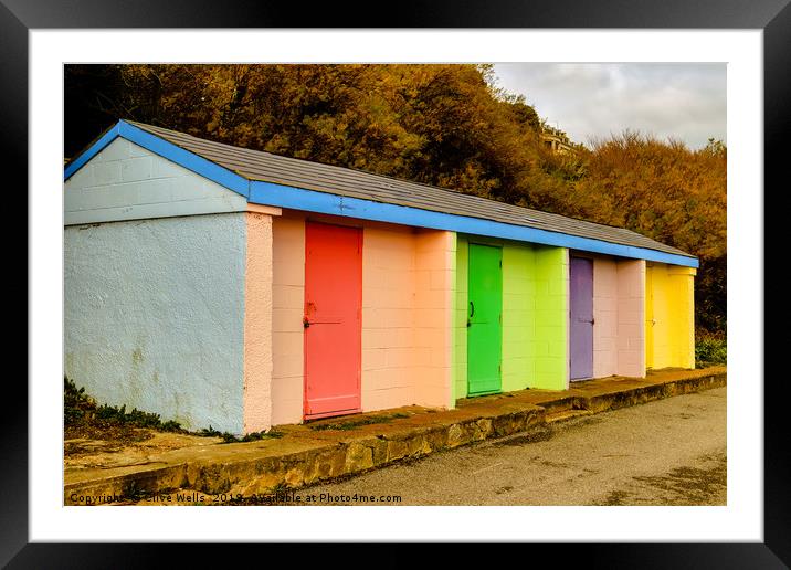 Colourful huts at Folkestone sea front Framed Mounted Print by Clive Wells