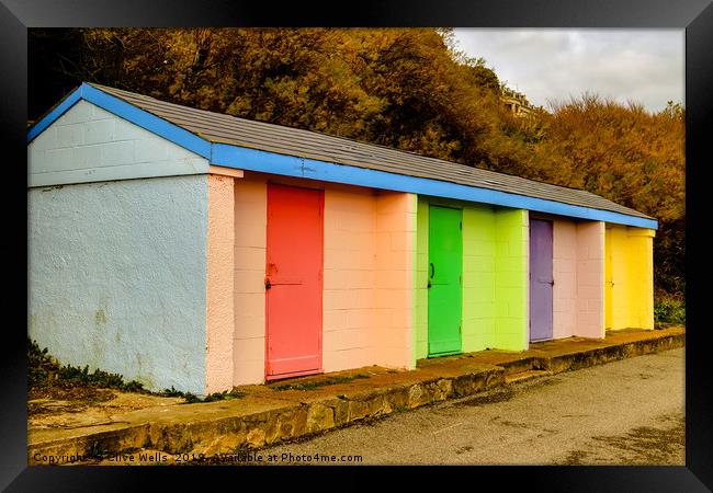 Colourful huts at Folkestone sea front Framed Print by Clive Wells