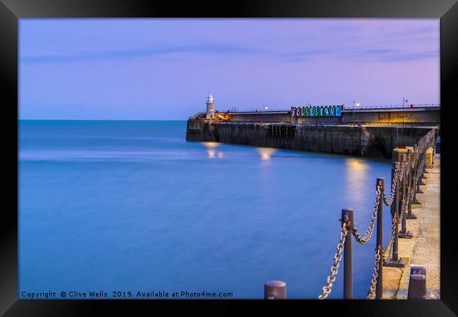 Folkestones Lighthouse at night Framed Print by Clive Wells