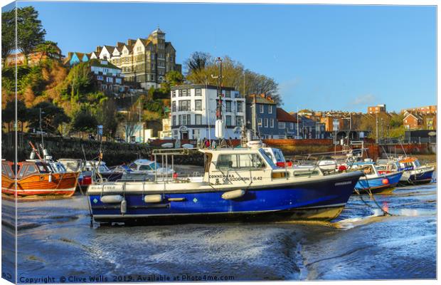 Boats at low tide at Folkestone Harbour, Kent Canvas Print by Clive Wells