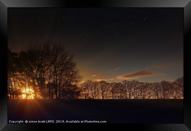 Big sunset glow through winter trees Framed Print by Simon Bratt LRPS