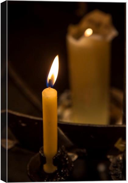 Illuminated Candle Canvas Print by Chris Dorney