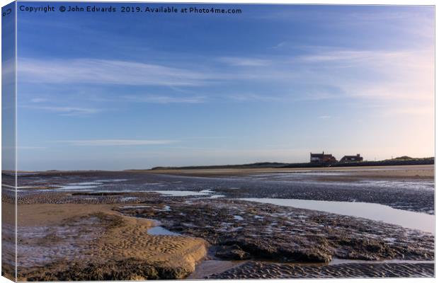 Secluded Shoreline at Brancaster Canvas Print by John Edwards