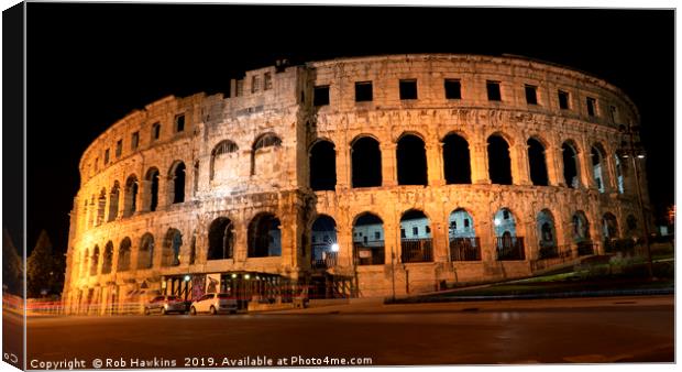 Pula Arena  by night Canvas Print by Rob Hawkins