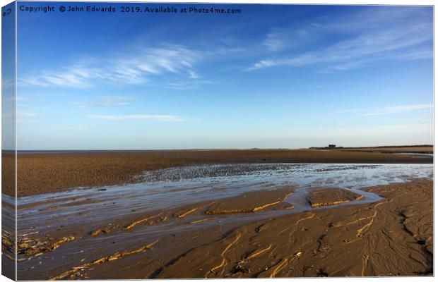 Seclusion on Brancaster Beach Canvas Print by John Edwards