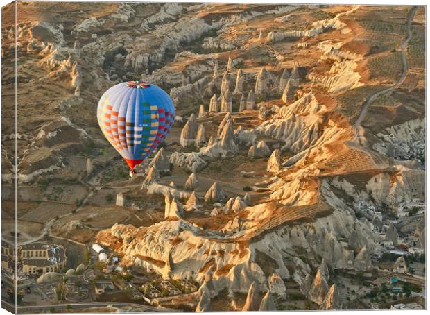 Sunrise Balloon Ascent Over Cappadocia Canvas Print by Ian Homewood